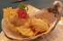 Ostra de la bretania en tempura con aliño de cebolla incurtida  y shiso